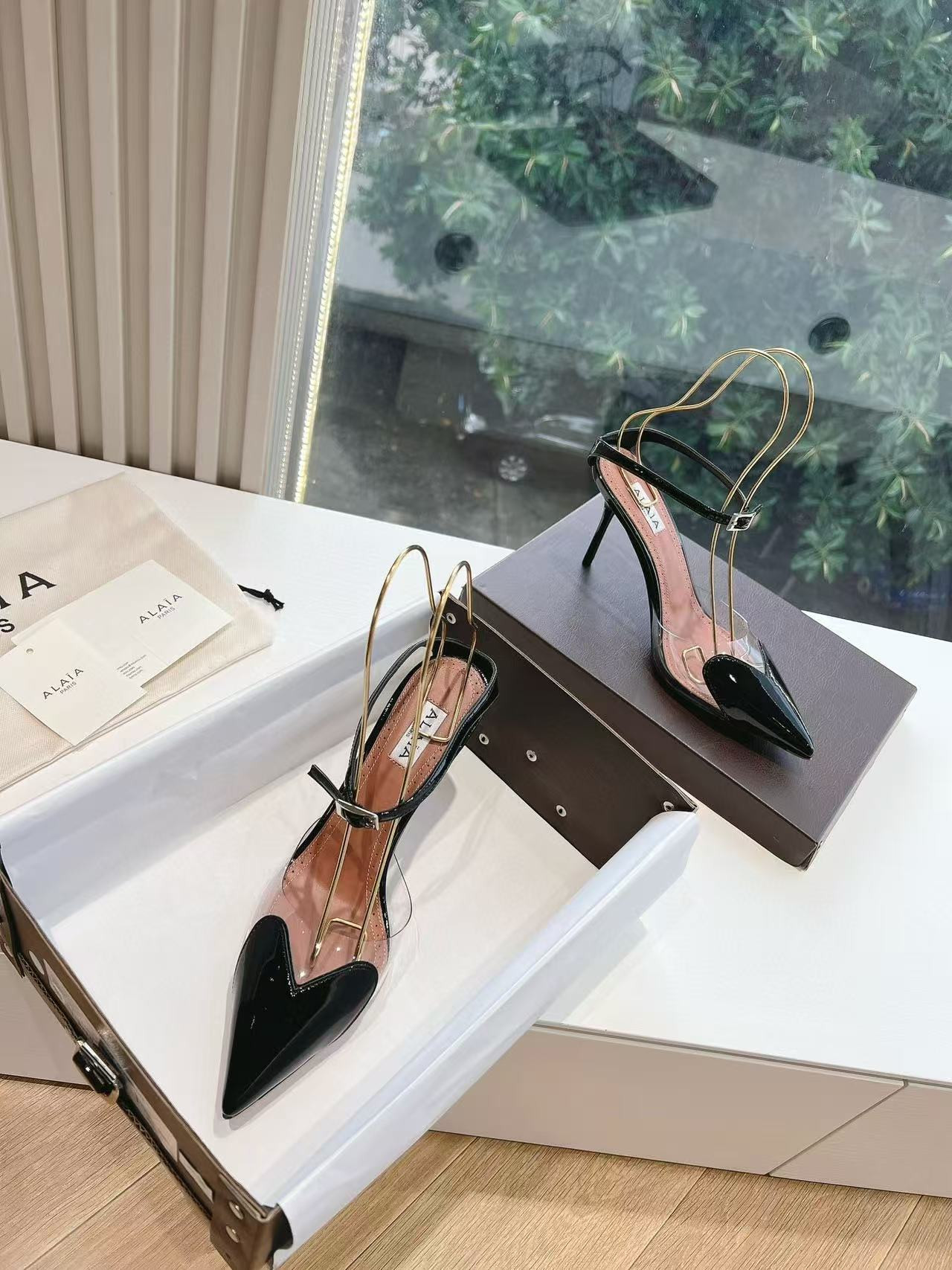 UA ALAÏA Patent Heart-Toe Stiletto Pumps