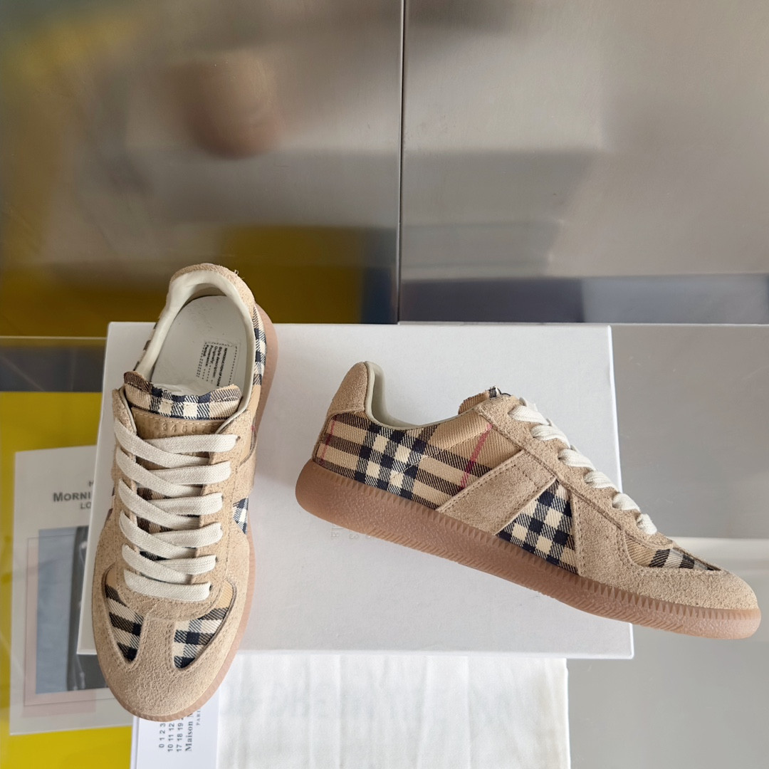 ua ma*s*n Ma*i*la mm6 sneakers